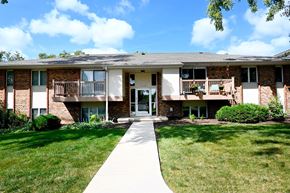 Omaha apartment for rent - A building with a white walkway in front of it.