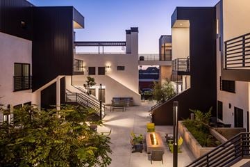 Ventura apartment for rent - A modern building with a courtyard and staircases.