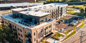 Barrington apartment for rent - an aerial view of an apartment building with a parking lot at Barrington 101, Barrington, 60010