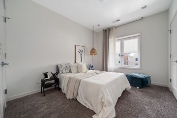 River Grove apartment for rent - A bedroom with a large bed and a window.
