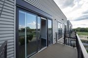 Barrington apartment for rent - A balcony with a glass door and a view of the outdoors.