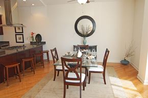 Chicago apartment for rent - a dining room with a glass table and chairs