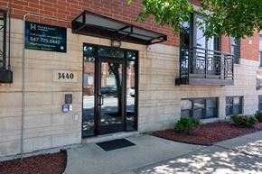 Chicago apartment for rent - The front of a building with a sign that reads