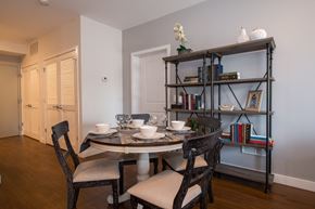 Chicago apartment for rent - a dining room with a table and chairs and a bookshelf