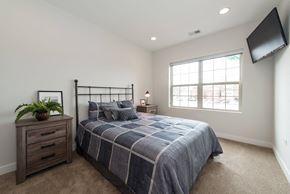 Chicago apartment for rent - a bedroom with a bed and a window