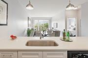 Barrington apartment for rent - a kitchen with a sink and a view of a living room at Barrington 101, Barrington, IL 60010