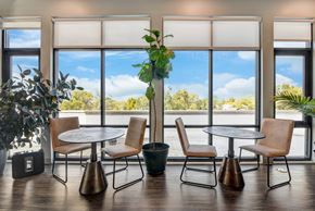 Barrington apartment for rent - a meeting room with tables and chairs and large windows at Barrington 101, Barrington, IL 60010