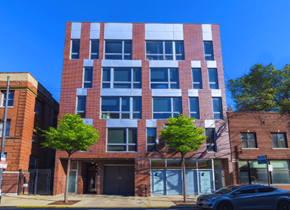 Chicago apartment for rent - Four-story apartment building at Highpoint Buena Park on Broadway with modern brick façade, located near Wrigley Field, Montrose Beach, and the Sheridan Red Line Station in Chicago’s Buena Park neighborhood