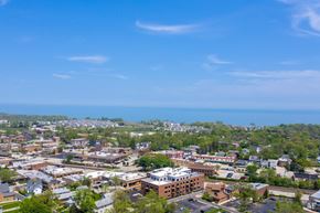 Highwood apartment for rent - an aerial view of a city with the ocean in the background