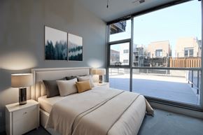 Chicago apartment for rent - a bedroom with a large bed and a large window