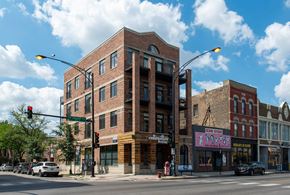 Chicago apartment for rent - a brick building on the corner of a city street at West Chicago 1701, Illinois