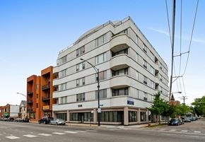 Chicago apartment for rent - a large white building on the corner of a street