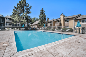 Englewood apartment for rent - A swimming pool surrounded by a patio and chairs.