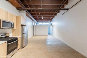 Los Angeles apartment for rent - A kitchen with wooden cabinets and stainless steel appliances.