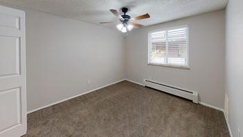 Bedroom filled with natural light and ceiling fan
