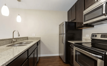 Updated kitchen with stainless steel appliances and built-in microwave