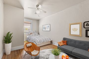 Denver apartment for rent - a living room with a couch and a bed