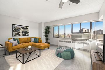 Denver apartment for rent - A living room with a yellow couch and a coffee table.