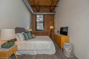 Chicago apartment for rent - Bedroom with plush carpeting at Carriage House Lofts, Chicago, Illinois