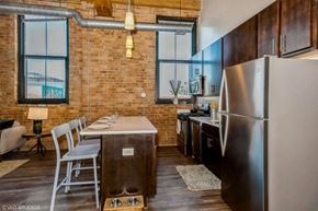 Chicago apartment for rent - Kitchen with a breakfast bar at Carriage House Lofts, Chicago, IL