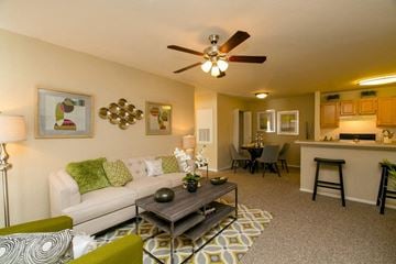 Panama City apartment for rent - A living room with a white couch and a coffee table.