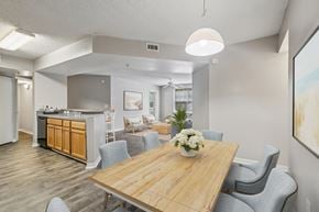 Jacksonville apartment for rent - A dining room with a wooden table and grey chairs.