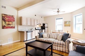 Chicago apartment for rent - a living room with a couch and a table