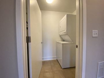 Chicago apartment for rent - a kitchen with a refrigerator and a washing machine