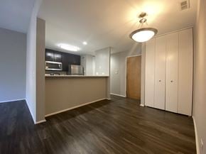 Chicago apartment for rent - Open kitchen with rich flooring and stainless steel appliances