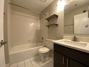 Chicago apartment for rent - Bathroom with vanity storage and a full tub