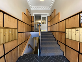 Chicago apartment for rent - A staircase with wooden steps and railings.