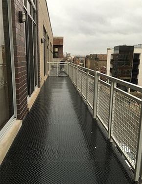 Chicago apartment for rent - a balcony with a metal railing and a building