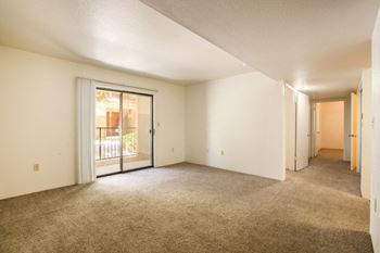 Spacious living room with natural lighting and patio access
