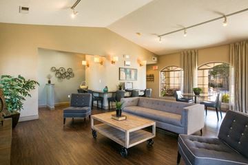 Albuquerque apartment for rent - A living room with a grey couch and a wooden coffee table.