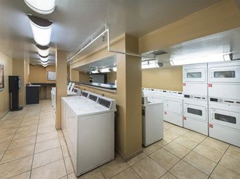 Laundry center with machines next to folding counter