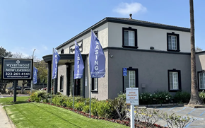 Los Angeles apartment for rent - a building with blue and white flags in front of it
