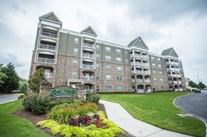 Virginia Beach apartment for rent - A large apartment complex with a sign that says "Evergreen Apartments".
