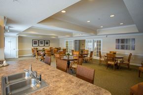 Virginia Beach apartment for rent - A kitchen with a sink and chairs.