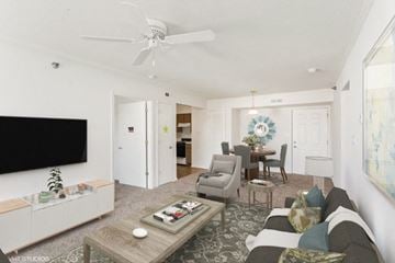 Newport News apartment for rent - A living room with a grey couch and a coffee table.