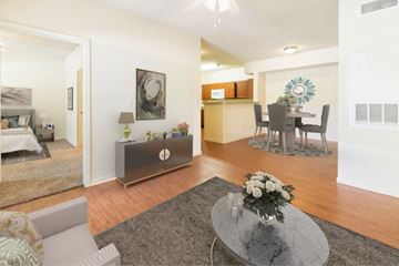 Houston apartment for rent - A modern living room with a grey coffee table and a grey sofa.