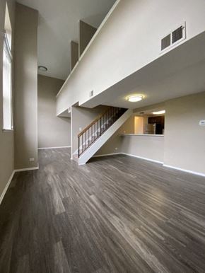 Chicago apartment for rent - Stunning living space with an exposed staircase