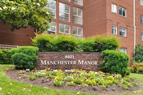 Silver Spring apartment for rent - A sign for Manchester Manor in front of a brick building.