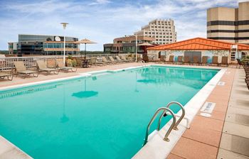 Rooftop pool with lounge seating and stunning views