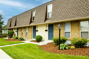 Columbus apartment for rent - A brown house with a blue door and windows.