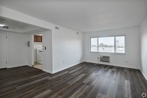 Bedford Heights apartment for rent - A room with a large window and a wooden floor.