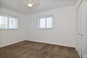Bedford Heights apartment for rent - A room with a carpeted floor and two windows.