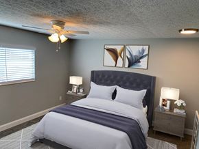 Groveport apartment for rent - a bedroom with a bed and a ceiling fan