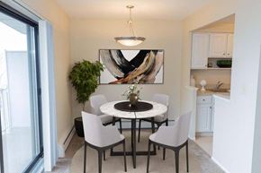 Euclid apartment for rent - a dining room with a table and chairs