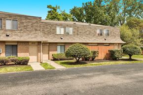 Columbus apartment for rent - a brick apartment building with a street in front of it