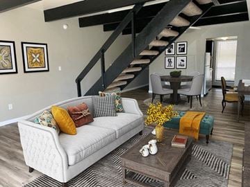 Medina apartment for rent - a living room with a white couch and a table